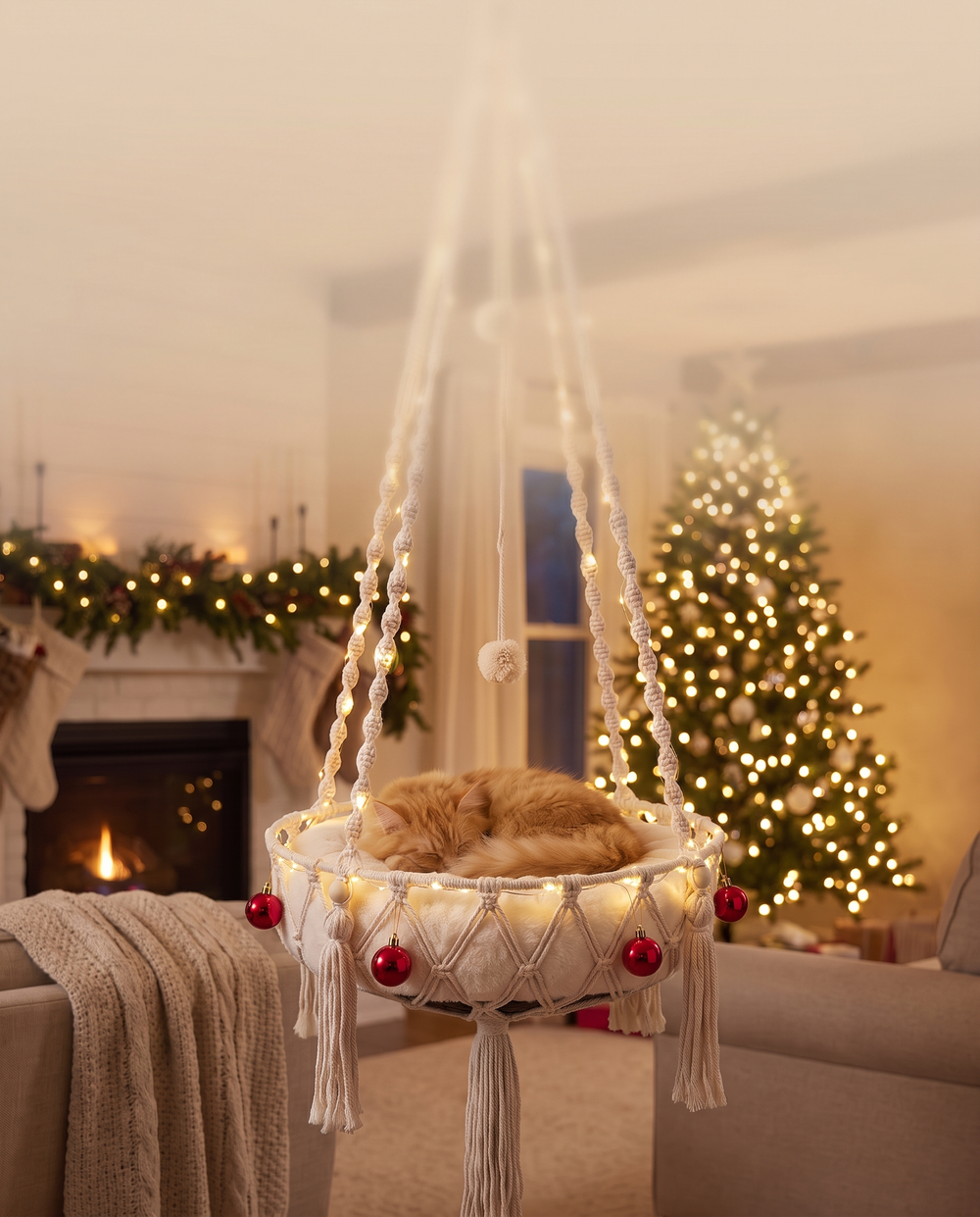 Purrcradle Christmas Edition hanging cat bed in a cozy Christmas living room